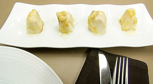 Merluza rebozada con salsa cítrica